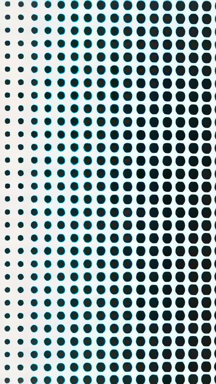Vertical video: Panning camera moving closer to dot panel in view, showing denser dots and cyan rim