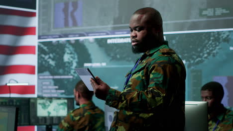 american military intelligence officers in command center monitor surveillance