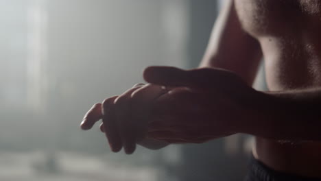 athlete clapping hands with talc powder. man using magnesium before exercise