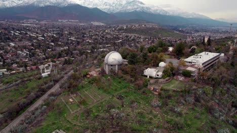 Aerial-orbit-of-the-Calan-hill-observatory-in-Santiago,-Chile