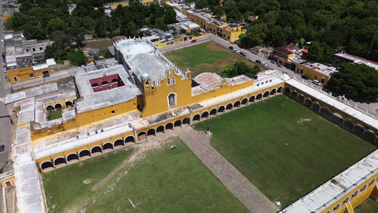 Aerial of the Convent of St. Antonio de Padua in Izamal, Yucatán, a vibrant historical and cultural landmark, yellow walls