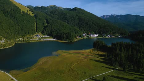 lake spitzingsee in the bavarian austrian sudelfeld wendelstein alps mountain peaks with romantic and lush green grass meadows-1