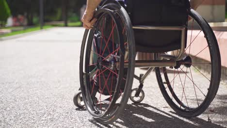 in slow motion, physically disabled man uses a wheelchair.