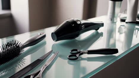professional hair tools on a glass surface
