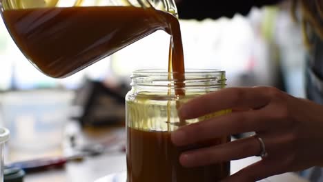 a step-by-step guide to jar filling: how to pour delicious homemade sauce with precision and care