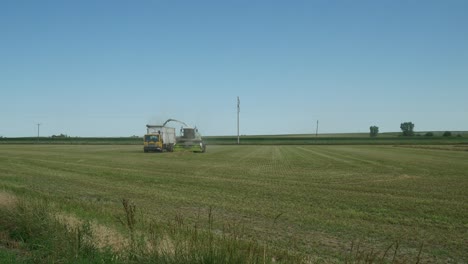 farmers harvest their crop in a mid-plains nebraska field