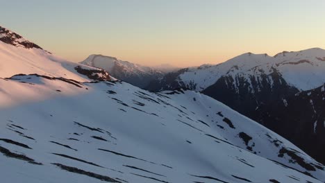 Drone-shot-from-norwegian-mountains-in-the-sunset-during-winter-time