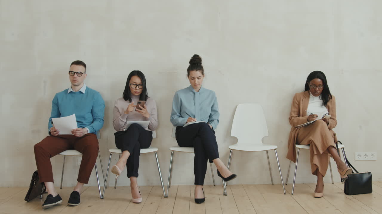 Men and Women Waiting for Job Interview