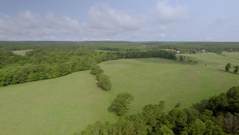 360 panoramic of beautiful southern missouri countryside with green pastures, red barn, and forests on a pretty summer day