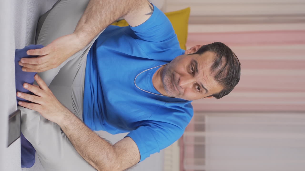 Vertical video of Disgusted man.