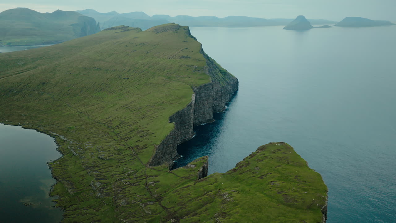 Dramatic Green Cliffs and Lake Overlooking the Ocean