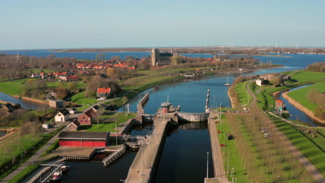 Aerial:-The-locks-of-the-Canal-through-Walcheren,-near-the-historical-town-Veere