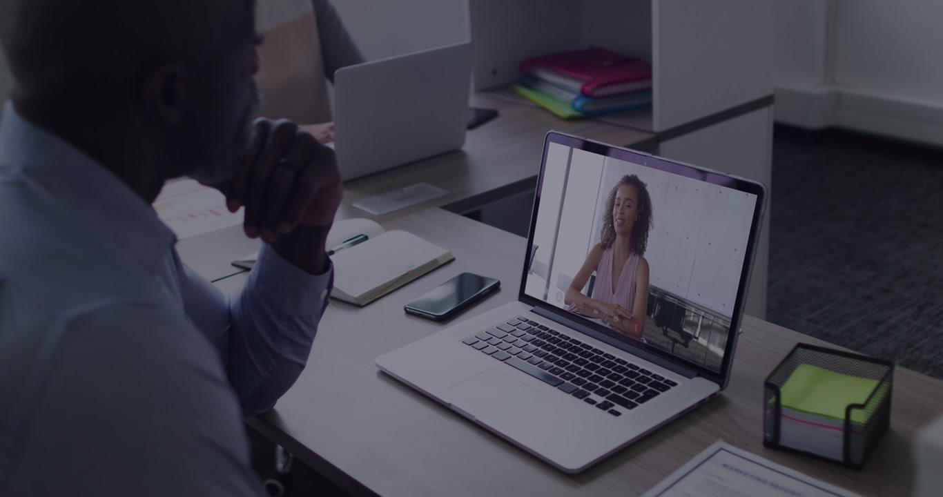 Animation of numbers processing over businessman using phone headset