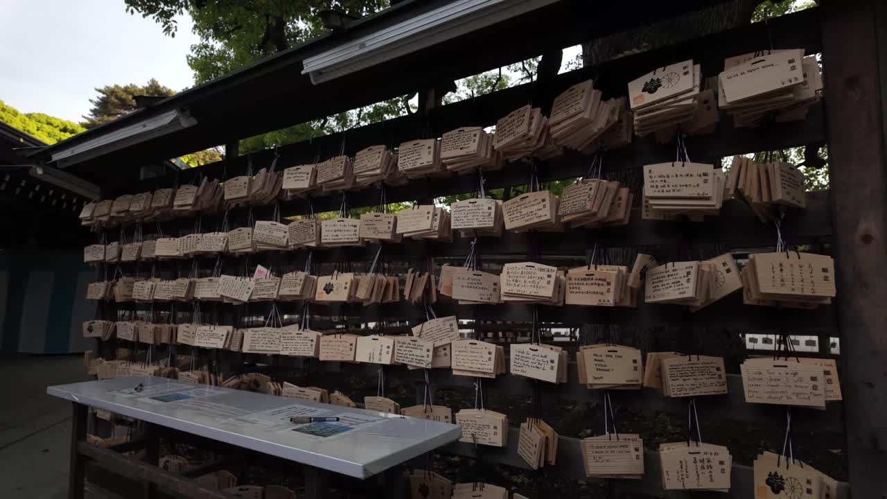 Collection of ema wood plaques Shinto used for writing prayers wishes Meiji Shrine Tokyo Japan