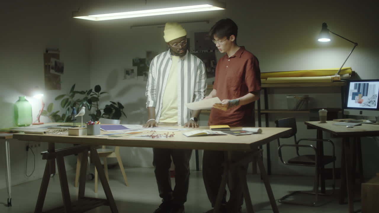 Two Designers Collaborating in a Creative Studio