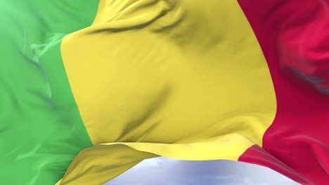 malian flag waving at wind with blue sky in slow, loop