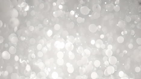 bokeh light circles animating over soft gray background