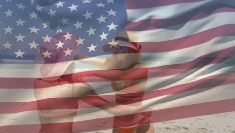 Animation-of-american-flag-over-caucasian-female-friends-at-beach