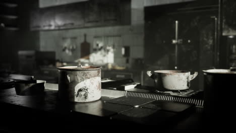 rusty pots and pans in a dark, abandoned kitchen