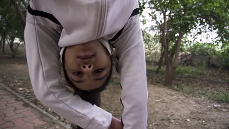 a sporty gymnast performs exercises with a rope in sportswear