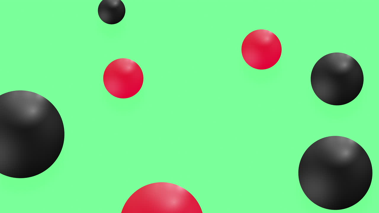 Red and Black Spheres Floating on Green Background