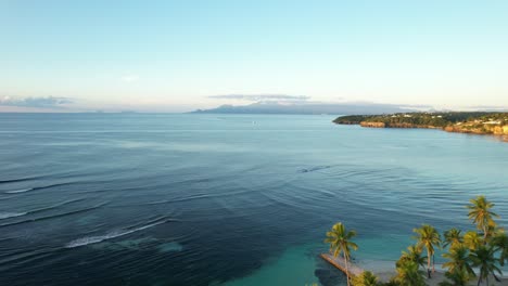 Aerial-view-of-Guadeloupe-Plage-Caravelle-region-with-palm-trees-and-ocean