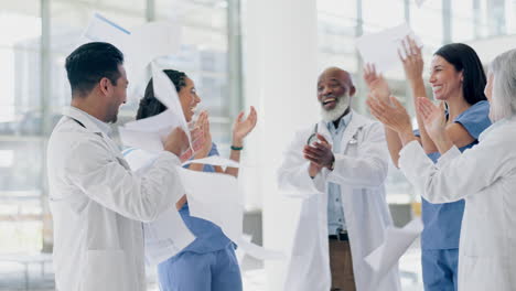 paper throw, high five and applause by doctors