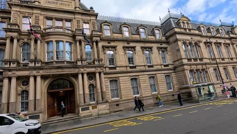 people and vehicles outside crown office, edinburgh