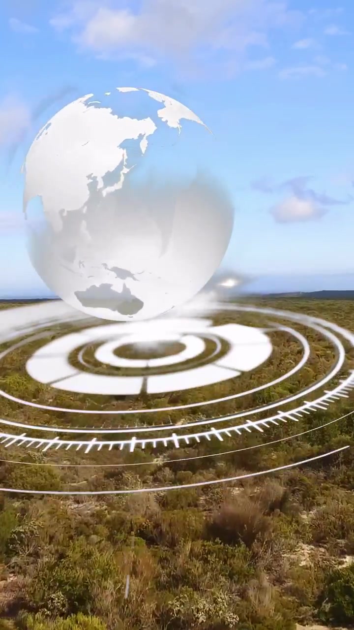 Pystysuuntainen video: Renkaat sykkivät pensaissa käynnistäen hologrammin, ja maapallo nousee pyörien näyttäen mantereita.