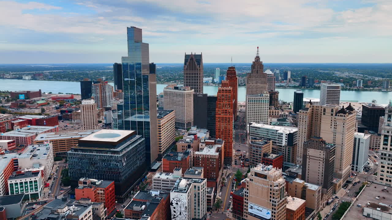 Footage above the urban landscape of modern Detroit, Michigan, USA. Approaching the waterscape of the Detroit River