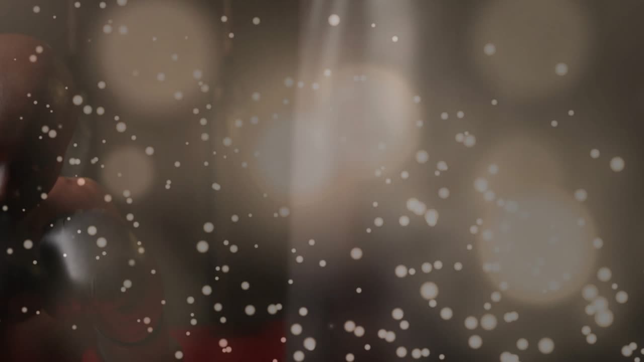 Male boxer entering frame training for sports as focus tightening revealing gloves bag, bokeh veil