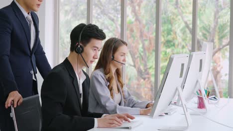 Business-people-wearing-headset-working-in-office