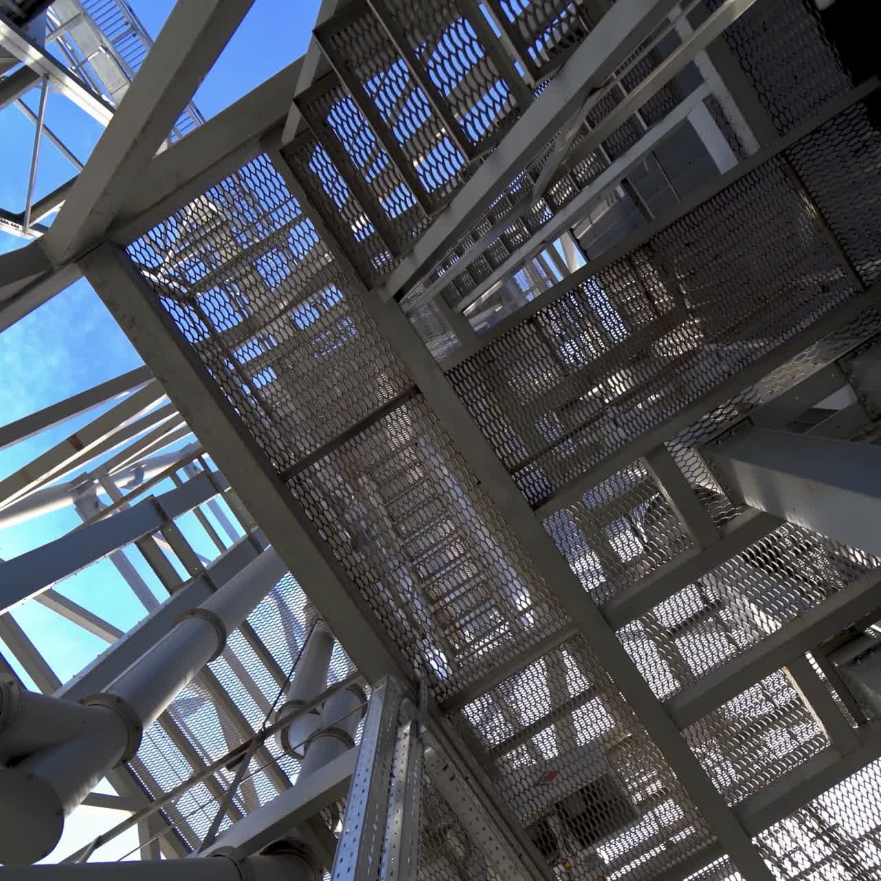 Steel construction of modern factory. Modern storehouse construction with metal structures of frame. Structural steel structure of new commercial building.