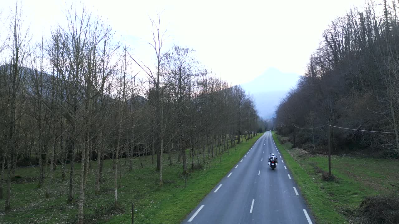 Motorcycle Ride Through a Scenic Valley