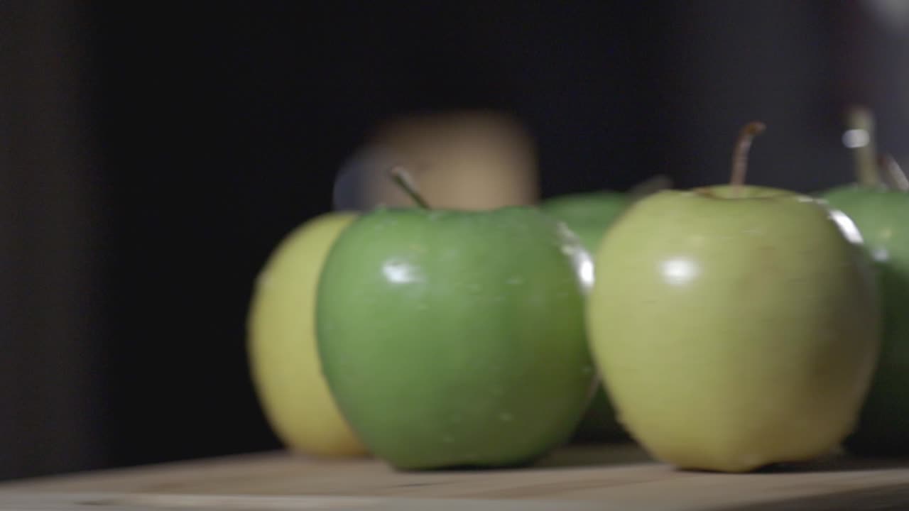 Freshly Washed Apples With Stalk Put On A Circle On The Turning Table. -close up shot