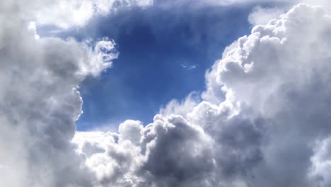 thick cumulus clouds in a clear blue sky