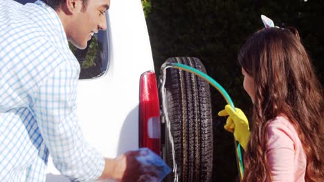 Father-and-daughter-washing-car-together