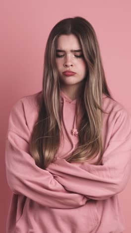 angry young beauty woman standing with arms crossed