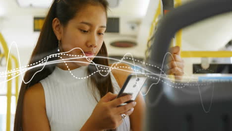 animation of diagram over biracial woman using smartphone in bus