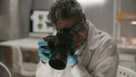 archaeologist capturing images of ancient bones in laboratory