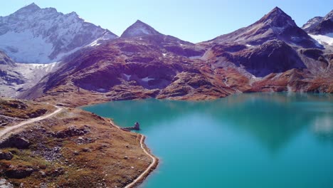 Picturesque-Landscape-Of-Mountain-And-Tranquil-Blue-Waters-Of-Weisssee-Lake-And-Reservoir-In-Summer-In-Austria