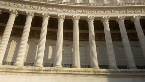 close-up of neoclassical colonnade with corinthian columns at altare della patria in rome, glowing in warm sunlight.