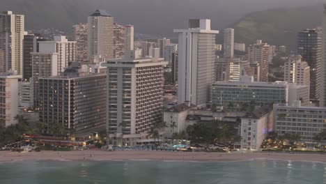 Aerial-Sliding-Shot-of-Waikiki-Neighborhood-and-Beaches-by-Morning,-Hawai,-O'ahu