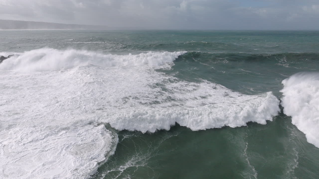 Extreme ocean force at famous iconic Nazaré, aerial drone shot