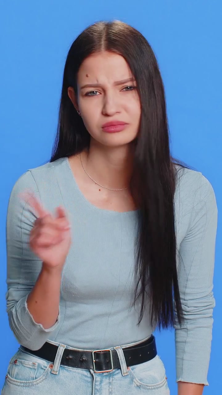 Caucasian young woman shakes finger and saying no be careful avoid danger mistake disapproval sign