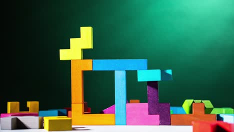 house is building with colourful wooden blocks, stop motion, animation. the concept of logical thinking.