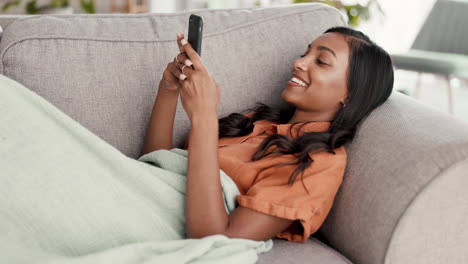 Woman,-phone-and-chatting-lying-on-living-room