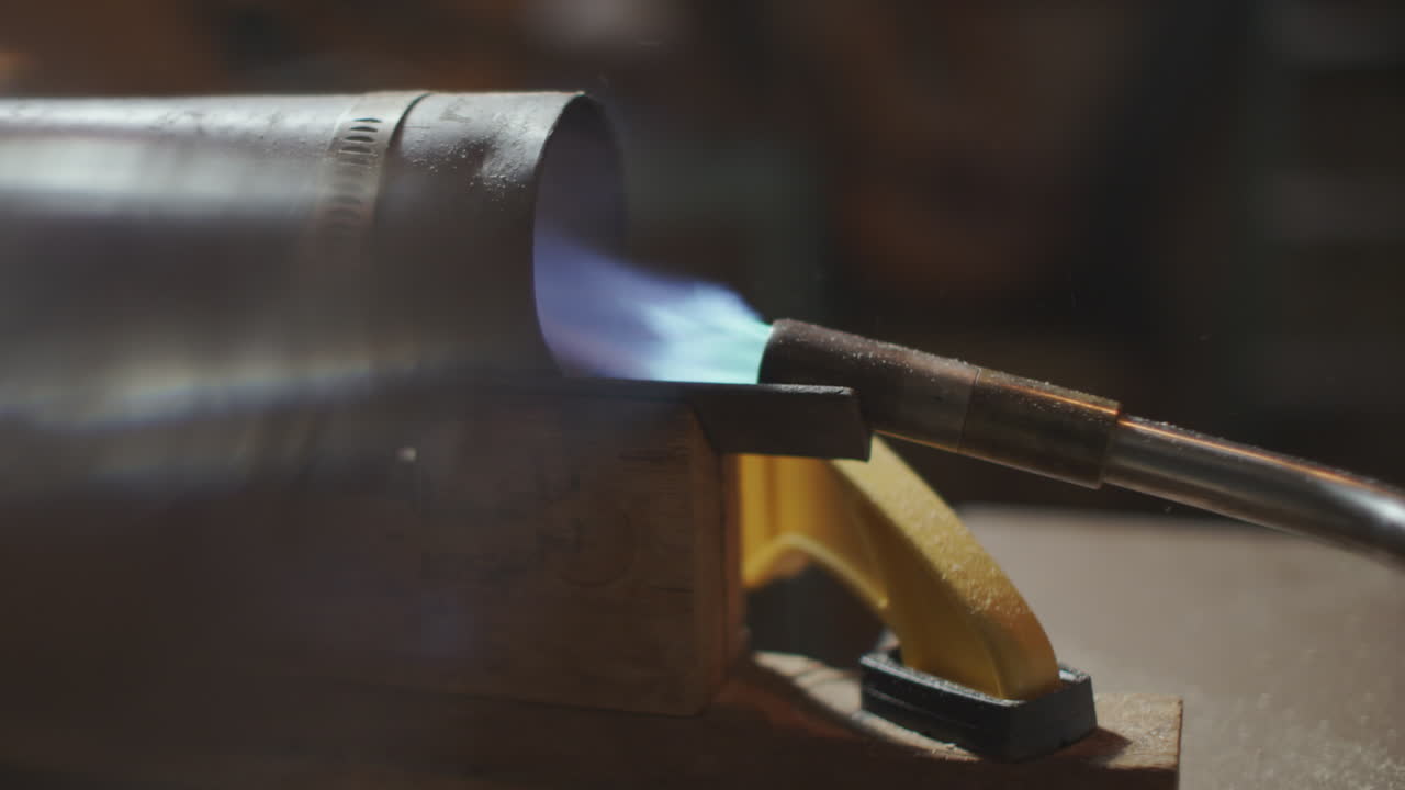 A blow torch fires into a tube