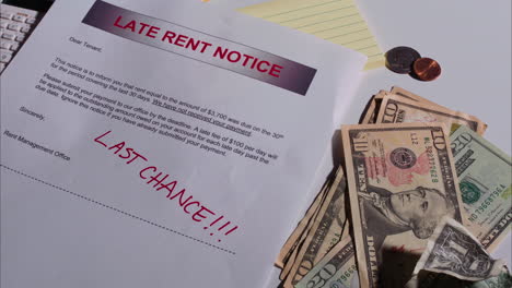 late rent notice drops down into shot