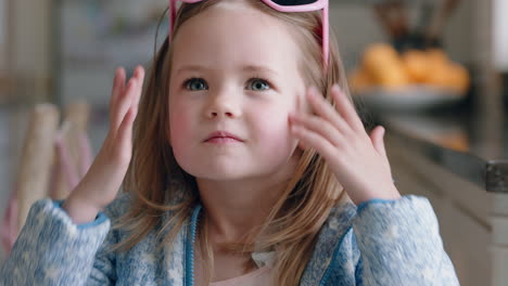 portrait-beautiful-little-girl-wearing-cute-sunglasses-having-fun-at-home-playing-dress-up-enjoying-childhood-imagination